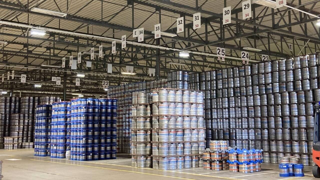 Image shows a warehouse full of kegs ready to be collected