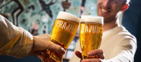 Friends having pints of Pravha